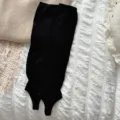 Black stirrup leg warmers for women, cozy knit long socks for autumn and winter outfits. - One Size / Black