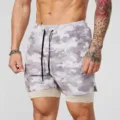 Detailed view of men's camouflage 2-in-1 athletic fitness training shorts with drawstring. - S / Grey Camouflage
