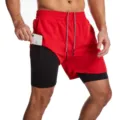 Primer plano de pantalón corto de running 2 en 1 para hombre con forro y bolsillo lateral. - Rojo