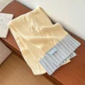 Gemütlicher gelb-grauer Winterschal mit Zopfmuster, warmer und stilvoller Farbton. - 25*170cm / Gelbgrau