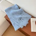 Light blue knitted scarf for women with cute black bow embroidery, soft winter warm wrap. - Blue