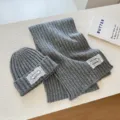 Stylish grey knit beanie and scarf set featuring delicate white lace patches for winter. - Grey Two-Piece Set (Hat + Scarf)