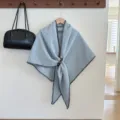 Light blue furry winter shawl cape with dark stitching and leather buckle for women variant. - Blue