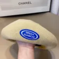 Knit beret hat detail view, beige woven retro style painter hat with rubber logo patch. - One Size / Off White