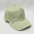 Light green baseball cap side detail showcasing cute metal smiley tag and clean stitching. - Adjustable / Light Green
