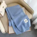 Sciarpa invernale in lana calda da donna, elegante accessorio lavorato a maglia spessa. - Celeste