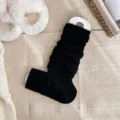 Solid black knitted leg warmers winter cozy fuzzy socks stylish stackable calf warmers - Black
