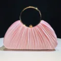 Elegant pink satin pleated evening clutch bag with round gold metal handle for women party. - Pink