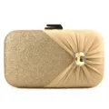 Gold glitter evening clutch bag detail showing pleated satin fabric and sparkling rhinestone buckle. - Gold