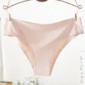 Detailed view of seamless women solid color brief hanging on rose gold metal hanger. - M / Light Coffee