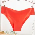 Seamless ice silk women underwear detail shot, comfortable breathable panty texture close-up. - L / Dark Orange