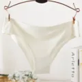 Close-up detail of seamless women's ice silk panties, showing smooth edge and soft fabric. - M / Ivory White