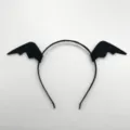 Close-up detail of the black bat wing headband, showing fine fabric texture and neat stitching. - Black Bat Wing Headbands