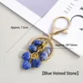 Natuurlijke sodaliet hart sleutelhanger en tasbedel met gouden metalen afwerking. - 10mm Hart Sodaliet / Lengte 7.5cm (Hart 10x10mm)