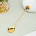 Cuchara larga dorada con colgante de corazón de cristal natural para postre café y té. - Ojo de tigre / Aprox 1.5cm Corazón