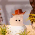 Cute pink crystal raw stone figurine with cowboy hat and tiny eyes for home decoration. - Crystal Little Cowboy ~ Clear Quartz
