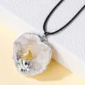 Natural crystal agate geode pendant necklace with silver plated edge and black cord. - Split Geode with Citrine Teeth