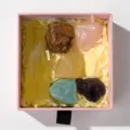 Natural crystal rough stone gift set with hexagonal prism and mixed raw minerals in pink box. - Yellow Crystal Pillar Set