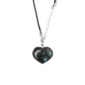 Detailed view of a natural labradorite heart pendant necklace with black cord and chain. - Labradorite