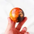 Natural golden stone crystal sphere detail view, vibrant multi-color mineral gemstone ball decor. - Realgar Stone Sphere / Approximately 5.5-6cm