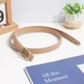 Minimalist chic women's thin belt with elegant gold buckle, perfect for dresses and suits. - Beige