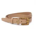 Detailed view of women leather belt featuring vintage gold geometric buckle, exquisite accessory. - Beige