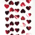 Detail shot of red metallic heart paper garland for Valentine day wedding party hanging decor. - Red Card / 4M