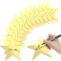 Gold star paper cutouts detail view showcasing handwritten name tags for party wall decor. - 24 Pieces / Gold Card