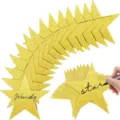 Detailed view of sparkly gold star decorations with glitter surface and handwritten text. - 24 Pieces / Gold Glitter