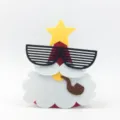 Closeup detail of cute felt Santa Claus hat with star and sunglasses for kids party decor. - Santa Claus