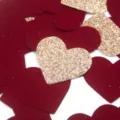 Close-up detail of 3cm red and gold glitter heart confetti for wedding and birthday party. - Glitter Champagne Gold and Red Hearts (Approx. 20g/Pack)