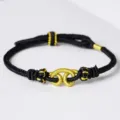 Handgemachte schwarz-goldene geflochtene Armband Ethnischen Stil Detailansicht Textur. - Wukong Handseil Schwarz