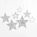 Silver glitter star hanging decorations, hollow star ornaments for party and holiday home decor. - Silver