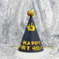 Birthday party cone hat with gold crown and glitter pom-pom, perfect for kids celebration. - Crown on Blue (Sequin Ball)