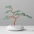 Natural green crystal money tree bonsai ornament with white ceramic base for home decor. - Aventurine Welcome Pine