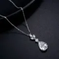 Elegant silver-tone pendant necklace featuring sparkling pear and marquise cubic zirconia stones. - 14k / Silver