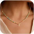 Close-up detail of a colorful beaded necklace featuring a gold letter P pendant and vibrant beads. - Letter L / 1 Piece