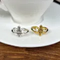 Vintage metallic open rings featuring classic heraldic fleur-de-lis motif for daily wear. - Gold