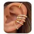 Detailed close-up of stacked gold ear cuffs worn on ear cartilage, sparkling cubic zirconia. - e2132 Gold Single Ear / 5 Pieces