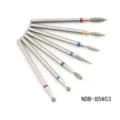 Detail shot of 7 piece nail drill bits set with colorful rings for manicure removal and shaping. - NDB-85-03#
