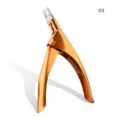 Detailed view of gold metal U-shaped nail clipper, essential tool for acrylic nail art. - 03# Gold