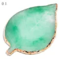 Green leaf shape resin nail art palette with gold edge for gel polish mixing and display. - Green