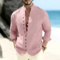 Men's casual long sleeve linen shirt detail showing button-down collar and chest pocket design. - Pink