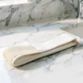 Detail shot of double-sided back scrubber strap, cotton linen texture with mesh surface for bath. - Regular Fit
