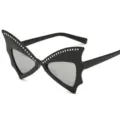 Black bat shaped party sunglasses with rhinestone trim, perfect for Halloween and fun events. - Black Frame Silver Mirrored Lens