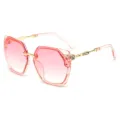 Stylish pink gradient polygon sunglasses for women with gold metal temples and rhinestones. - Transparent Pink Frame Pink Lens