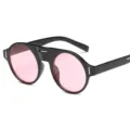 Lunettes de soleil rondes élégantes avec monture noire épaisse et verres roses tendance. - Monture Noire Verre Rose