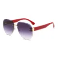 Gafas de sol degradadas sin montura de moda con patillas rojas y puente metálico dorado. - Rojo