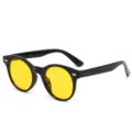 Ovale Sonnenbrille mit gelben Gläsern und Nieten Damen Herren modischer UV-Schutz Stilsicher - Schwarzer Rahmen Gelbe Gläser