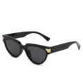 Modische schwarze Cat-Eye Sonnenbrille für Damen mit goldenen Akzenten und starkem UV-Schutz. - Schwarzer Rahmen Schwarz Graue Gläser